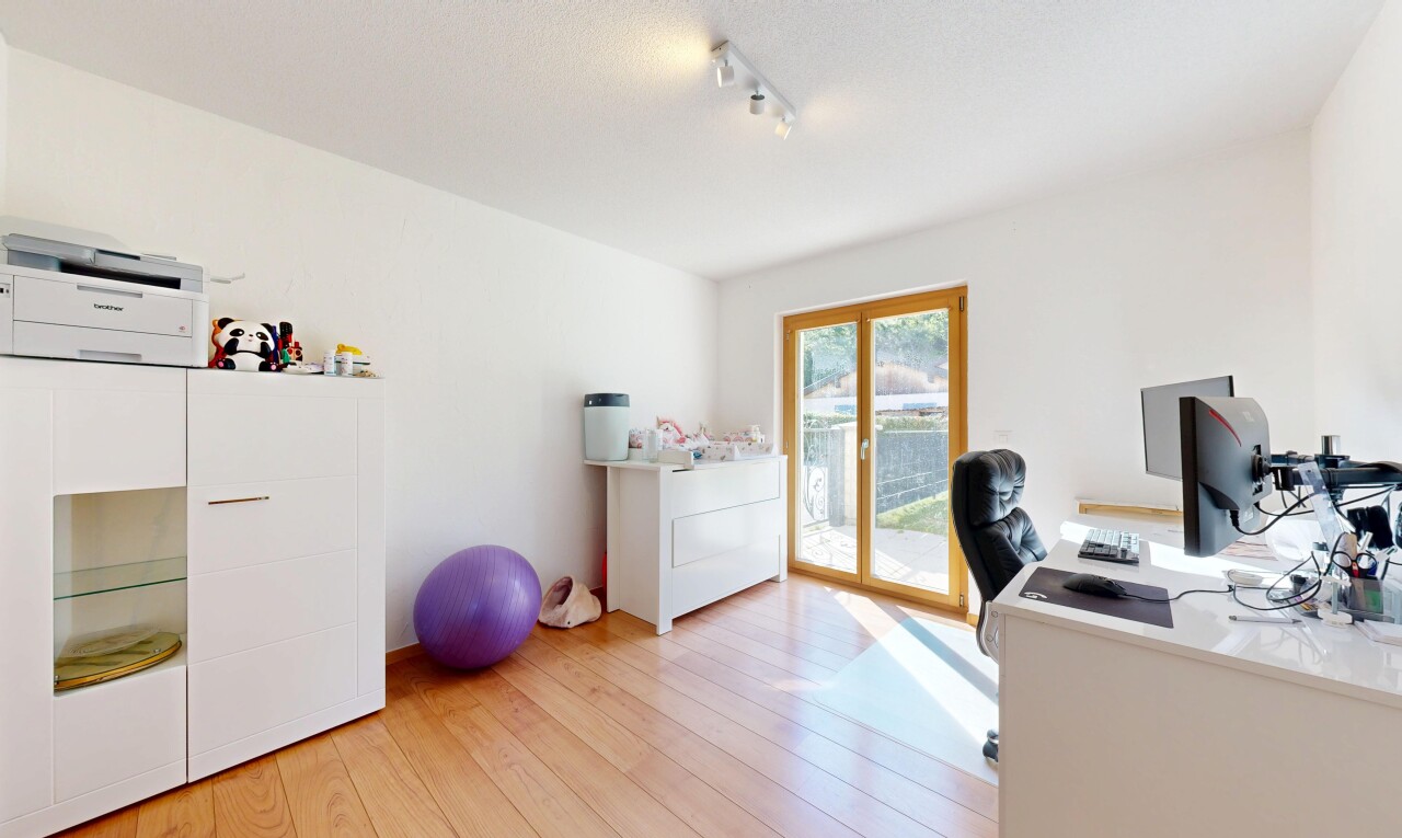 office with light wood-type flooring, track lighting, and french doors