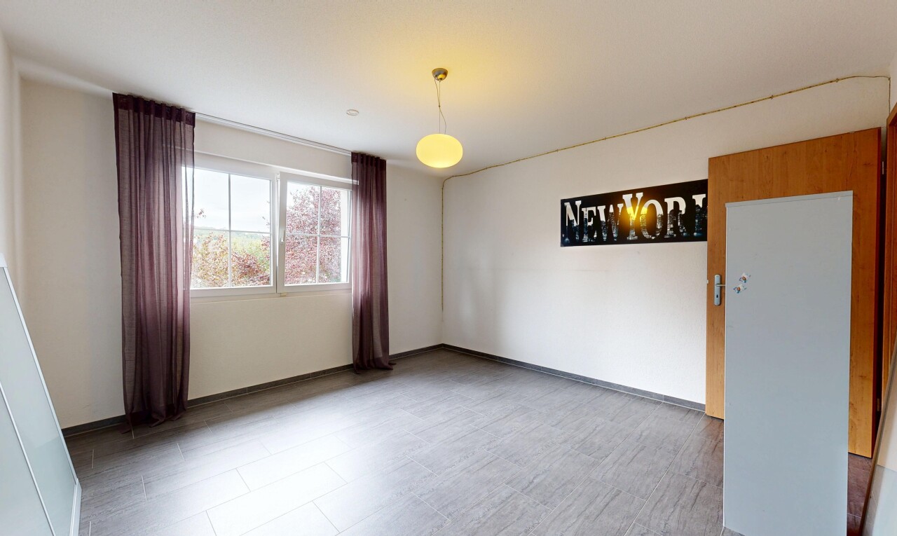 spare room featuring baseboards