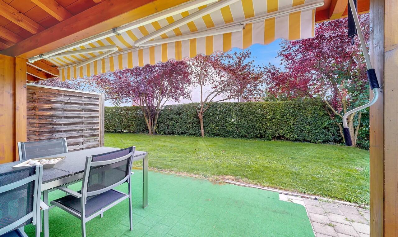 garden with a patio, a yard, and outdoor dining space