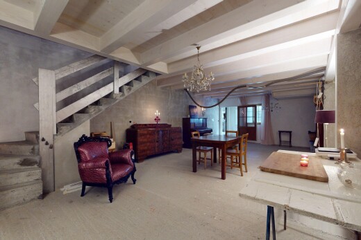 interior space featuring an inviting chandelier and beamed ceiling