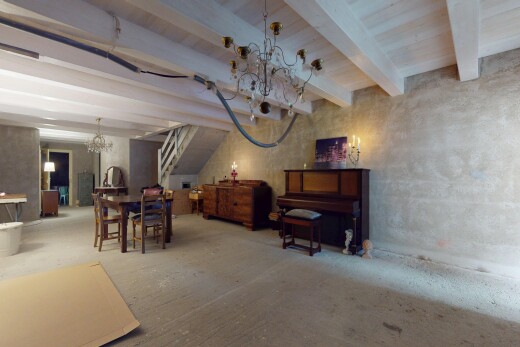 living / dining room with beam ceiling